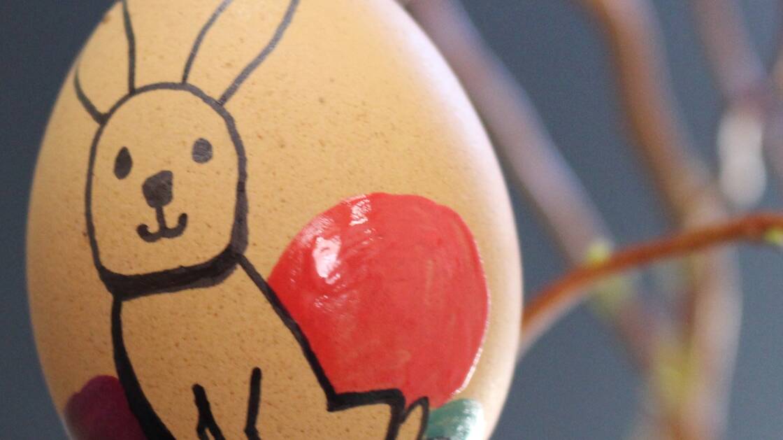 Brown hen's egg with bunny drawing as Easter egg